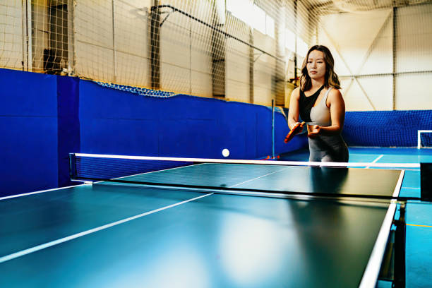 istock A woman playing ping pong 2153273437