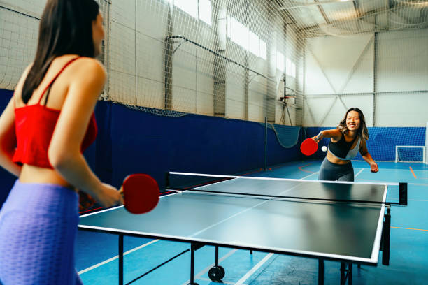 A women playing ping pong
