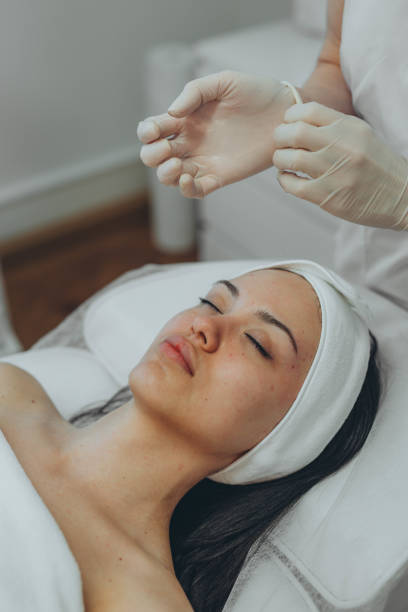 istock girl at a cosmetologist's office doing skin cleansing 2153275072