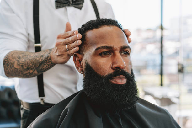 istock Barber cutting hair in barber shop 2153275981