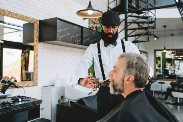 istock Elderly man cutting his beard in barbershop 2153276335