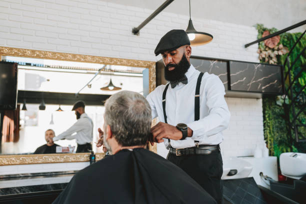 istock Elderly man cutting his beard in barbershop 2153276343