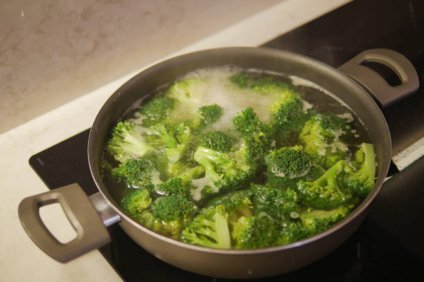 istock cooking broccoli in pan on electric stove 2153282178