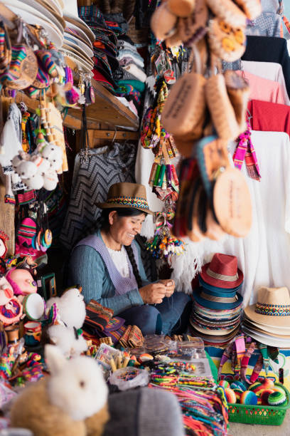 istock Latin woman smiling and working in a typical souvenir store 2153283406