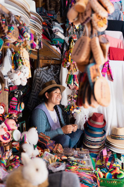 istock Latin woman smiling and working in a typical souvenir store 2153283419