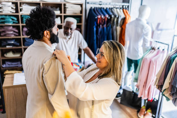 istock Tailor measuring a mature man for a new suit at the store 2153285909