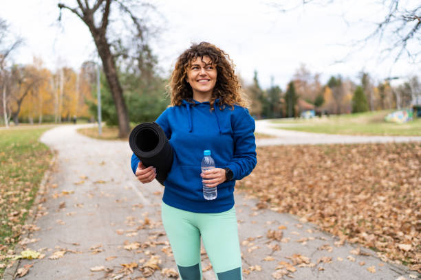 istock Fitness woman takes a refreshing break with fresh, cold water drinking 2153290793