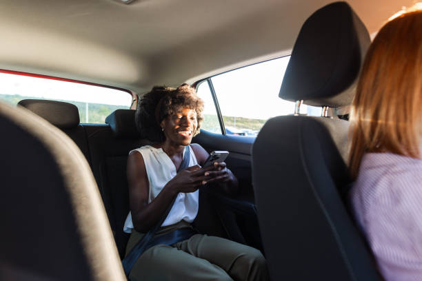 istock A young commuter using her smart phone during the car ride 2153292089