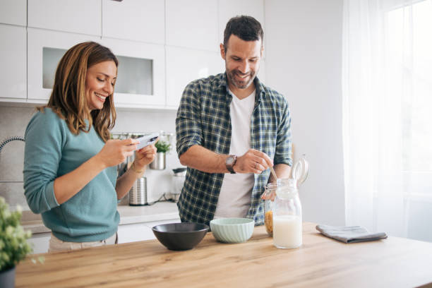 istock mature happy couple having breakfast at home 2153296276