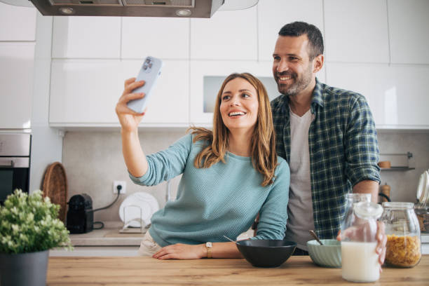 istock mature happy couple having breakfast at home 2153296277