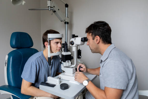istock Ophthalmologist examining patient in his office 2153300155