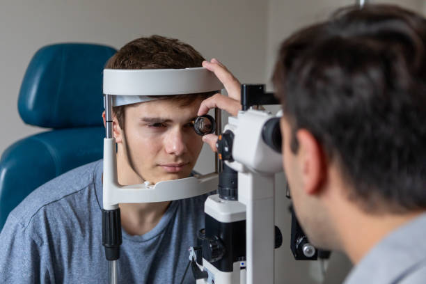 istock Ophthalmologist examining patient in his office 2153300231