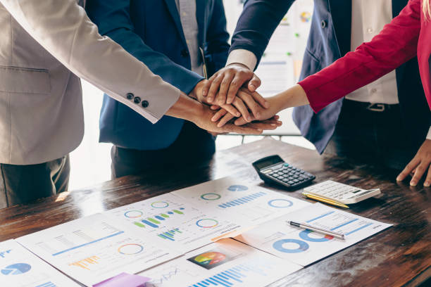 istock Business people shaking hands and meeting with the above documents to hire a partner or work together at the office in recruiting. Teamwork or research of a close-up marketing projec 2153302440