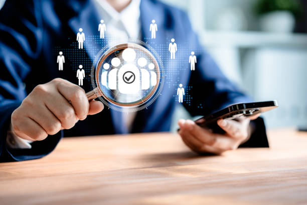 istock Human Resources Manager using magnifier glass finding with human icons, HRM, CRM, Recruitment Consultants, Headhunter, recruitment agency, Human Resources Management Concepts. 2153309073