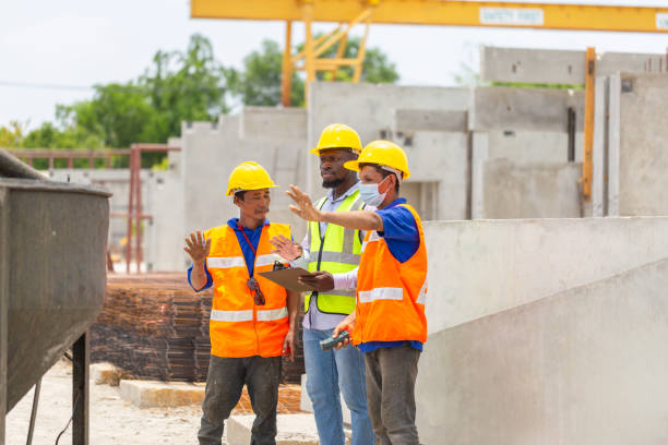 istock Construction workers at work, Foreman and worker team discussing at precast concrete factory site 2153316110