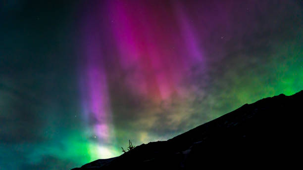 istock Northern Lights over a Mountain 2153318668