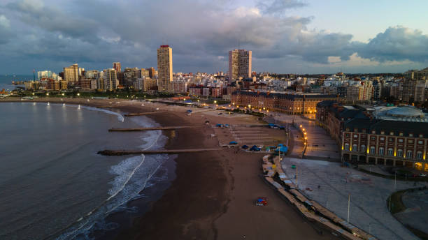 istock Ocean meets skyline as cityscape overlooks sandy beach 2153320811