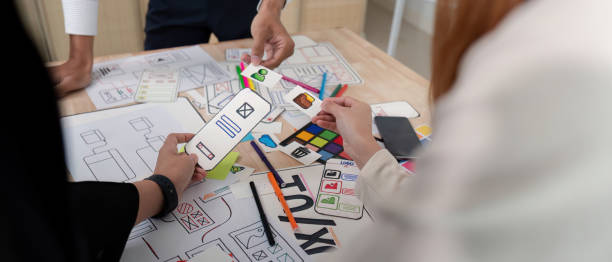 istock Brainstorm team of creative web graphic designer planning, Group of mobile phone app developer team meeting for share ideas about screen prototype layout for smartphone. startup planning ui and ux 2153321059