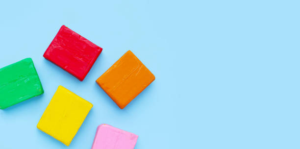 istock Colorful plasticine clay on blue background. 2153321102