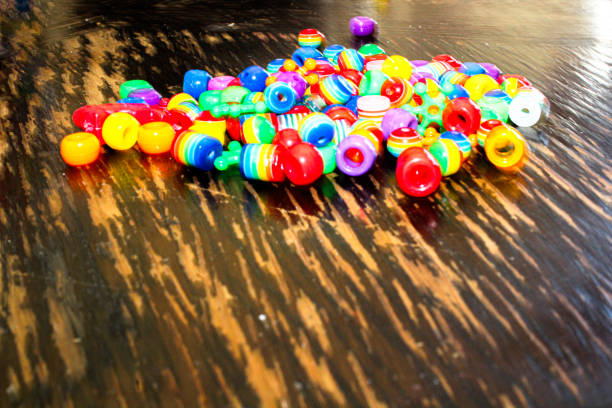 istock Colorful Rainbow Jewelry Beads on Table 2153321123