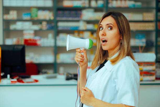 Pharmacist Holding a Loudspeaker Announcing Promotional Prices