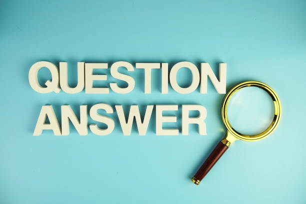istock Question and Answer alphabet letters with magnifying glass on blue background 2153326562