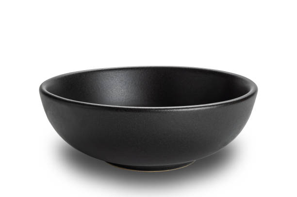istock Closeup view of empty black ceramic bowl isolated on white background. 2153329422