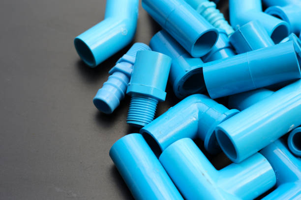 Plumber equipment with blue pvc pipe connections for plumbing work.