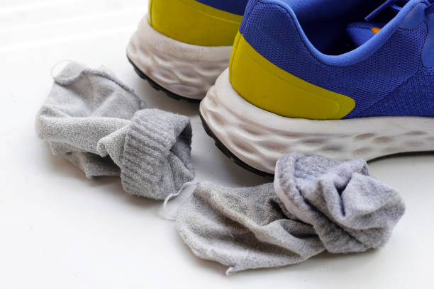 istock Blue sneakers with dirty socks 2153331143