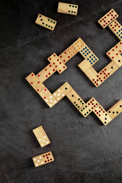 istock wooden domino game on black background 2153336759