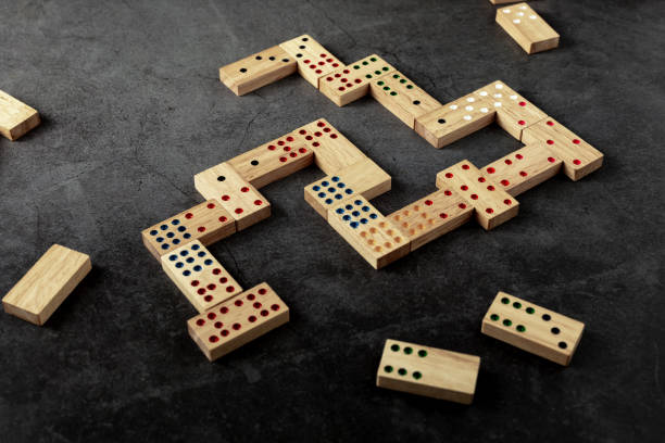 istock wooden domino game on black background 2153336764