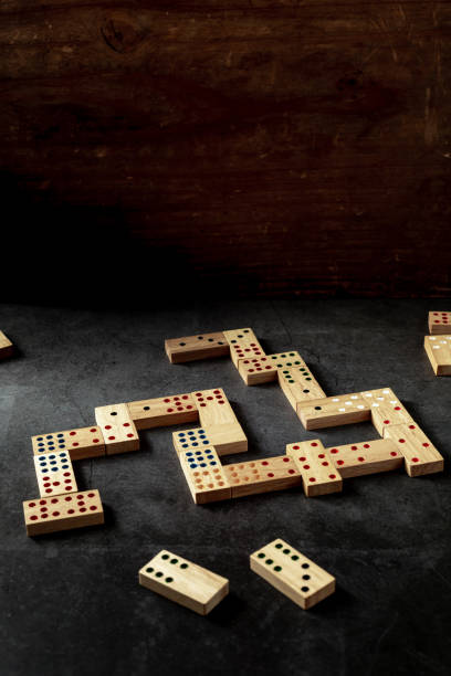 istock wooden domino game on black background 2153336768