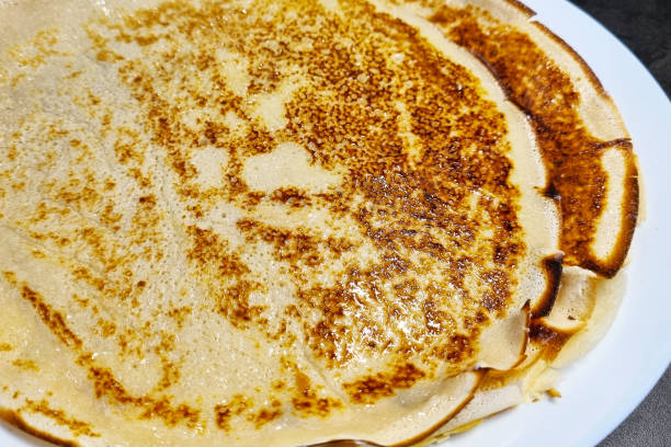 istock Delicious Homemade Cr pes Stacked on a White Plate 2153336851