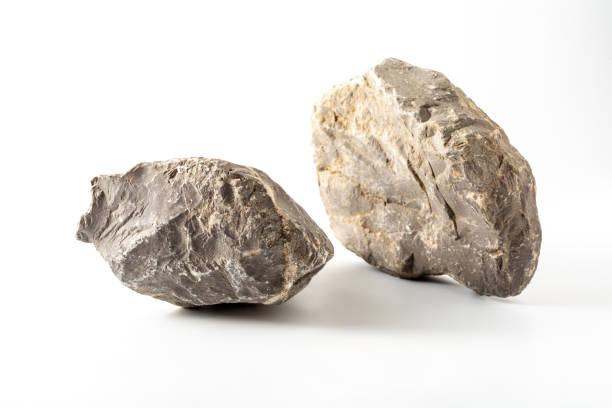 istock granite boulders on white background 2153336960