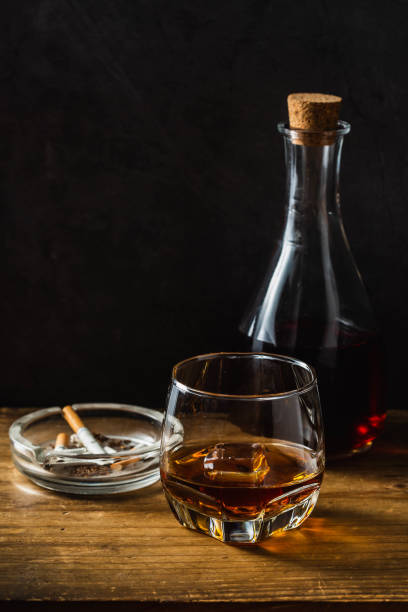 istock whiskey with ashtray on wooden background 2153337030