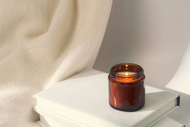istock Aromatic candle in glass jar close up 2153338200