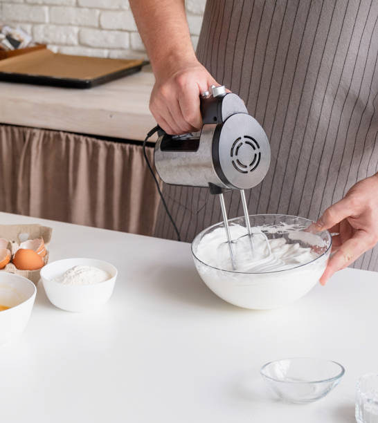 istock man wearing apron cooking tiramisu at kitchen 2153338681