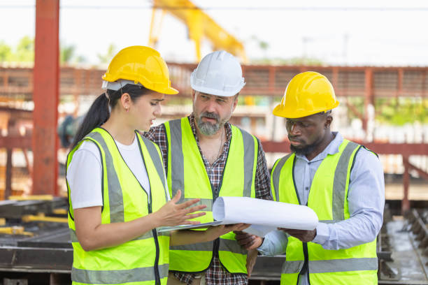 istock Engineer and builders in hardhats discussing on construction site, Engineer and foreman worker team checking project at precast concrete factory site 2153340838