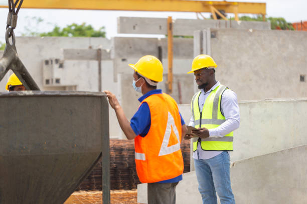 istock Construction workers at work, Foreman and worker team discussing at precast concrete factory site 2153340843