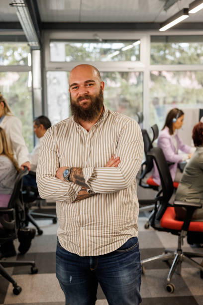 istock Satisfied young businessman in modern office 2153342592
