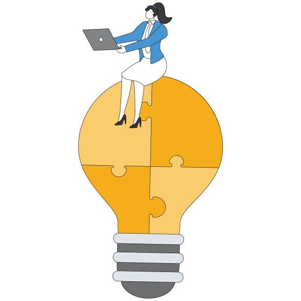 istock Lightbulb puzzle working on laptop Businesswoman 2153344987