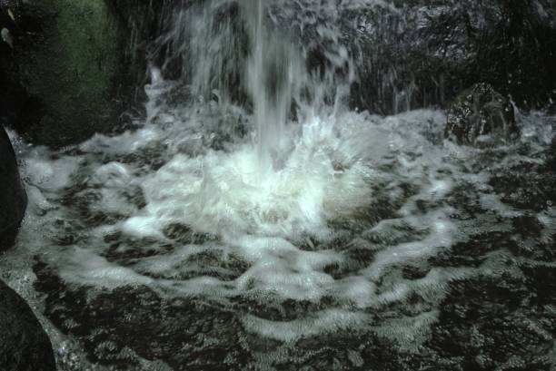istock Scenery of water flowing from a small waterfall. Waterfall background material. 2153345440