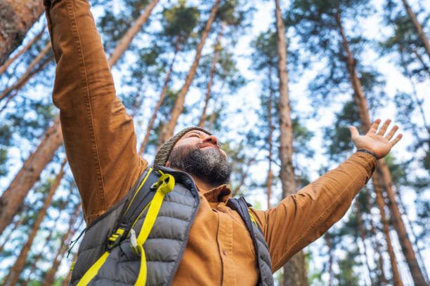 istock Happy man enjoying environment in the woods, close-up portrait, low angle view 2153346056