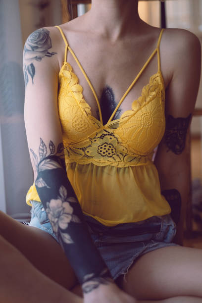 istock Young Beautiful Tattooed Woman 2153346436