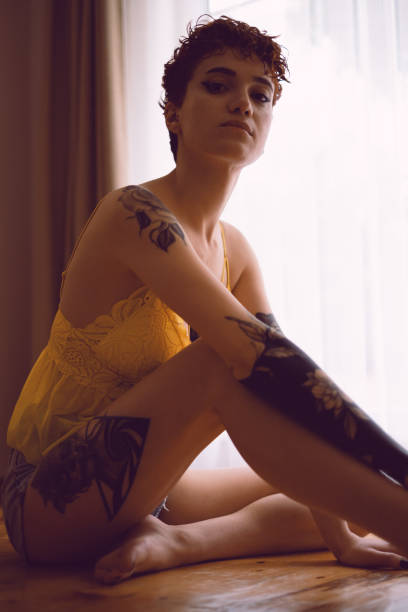istock Young Beautiful Tattooed Woman 2153346543