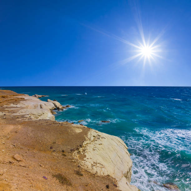 stony sea coast at the storm under a sparkle sun