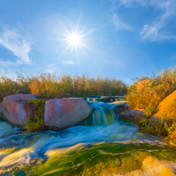 river rushing among mountain canyon at the sunny day