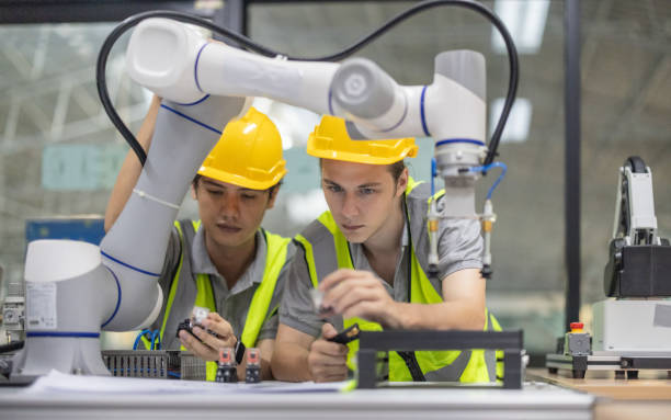 istock Trainees focus on robot arms, automation programs, and essential skills in the robotics academy. 2153355018