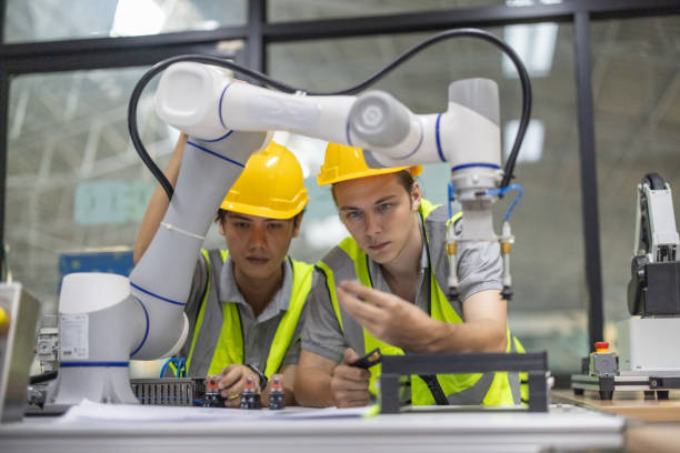 istock Trainees focus on robot arms, automation programs, and essential skills in the robotics academy. 2153355025