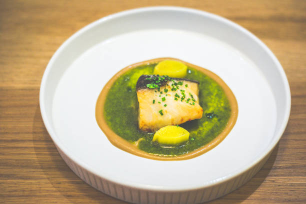 istock main course of Roasted Black Cod With Green Mojo And Leek 2153355789